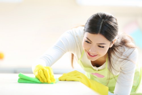 Cleaning crew treating stained carpet in a business corridor